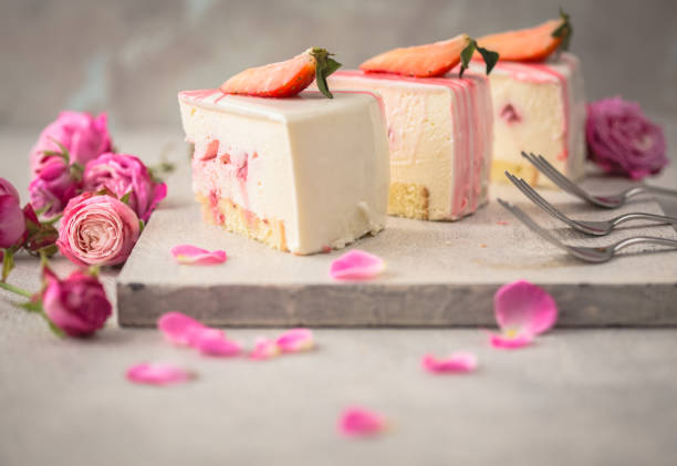 istock Strawberry mousse cake, cheesecake with fresh strawberries on light  background. Tasty strawberry mousse cake with biscuit layers and strawberries. mousse layer. 1198401320