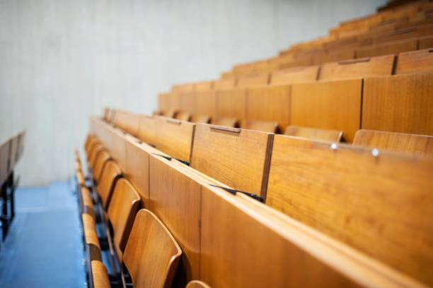 Empty benches in an auditorium stock photo