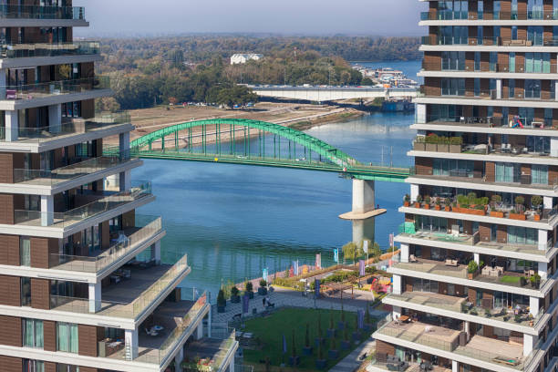 Belgrade, Serbia October 15, 2019: Belgrade Waterfront Vista Residences. Modern building facade in Belgrade. New settlement in Belgrade on Savamala with old railway bridge across the Sava River.
