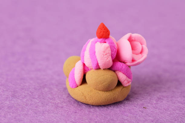 plasticine toy on pink background. modelling clay.