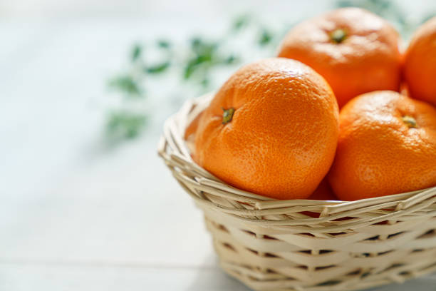 Fresh mandarin orange on wooden background