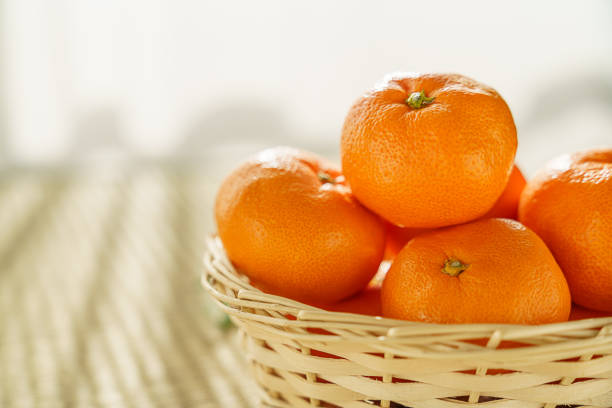 Fresh mandarin orange on wooden background