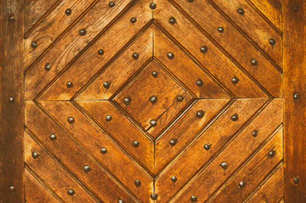 istock old wooden pattern with metal elements on a wooden door 1198407683