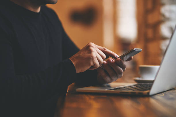istock Man working on his mobile phone and laptop 1198407863