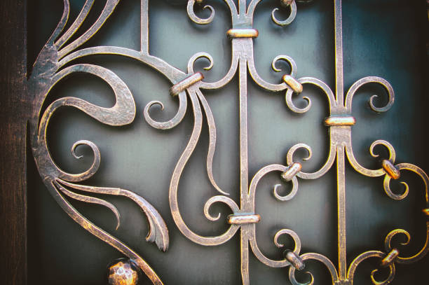 istock ornate wrought-iron elements of metal gate decoration 1198411424