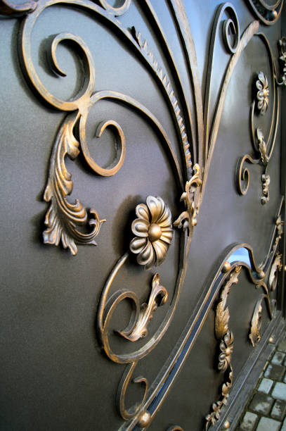 istock Modern metal doors decorated with forged elements with flowers 1198411444