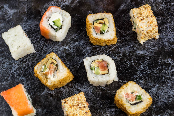 istock Set of sushi and maki on stone table. Top view 1198411740