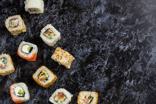 istock Set of sushi and maki on stone table. Top view with copy space 1198411747