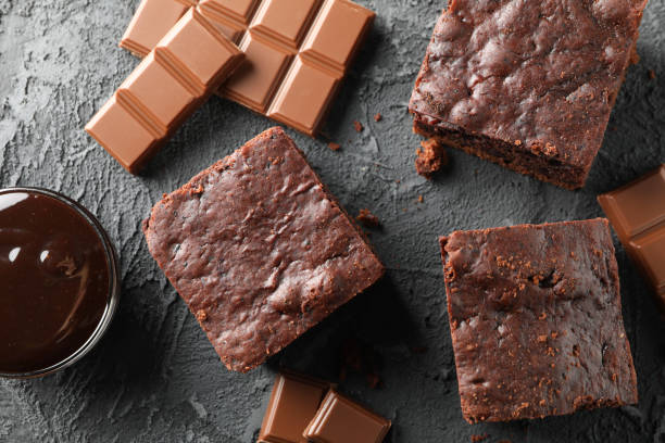 istock Chocolate cake slices and chocolate on black background, close up 1198412455
