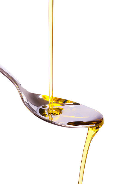 istock olive oil poured into spoon 119841323