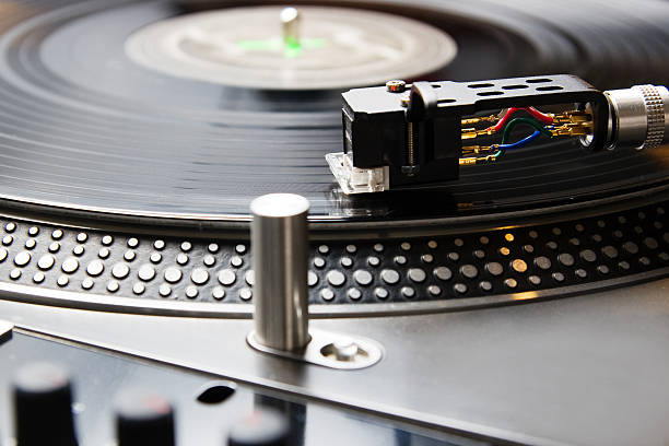 istock Turntable playing vinyl record with music 119841352