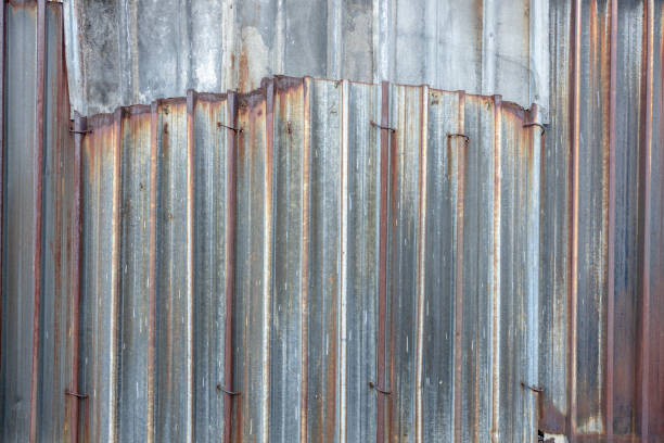 istock Old rusty sheet metal fence background 1198413986