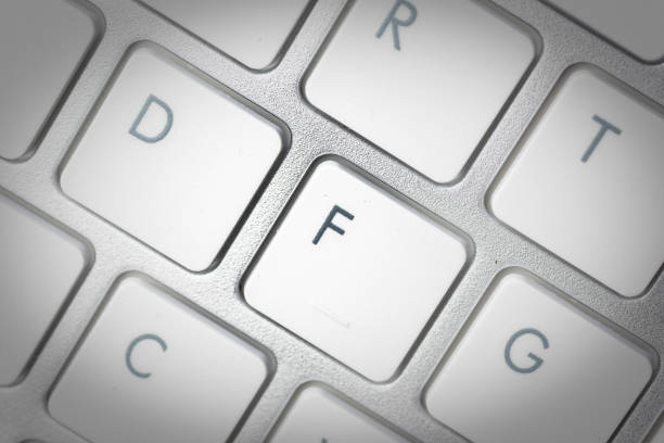istock Computer keyboard - silver keyboard of a laptop with button F isolated. Home office with portable modern technology, IT and computing. 1198415343