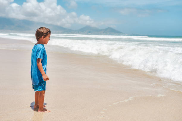 Shot of an adorable little boy having a fun day at the beach