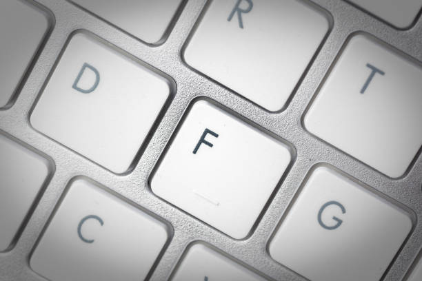 istock Computer keyboard - silver keyboard of a laptop with button F isolated. Home office with portable modern technology, IT and computing. 1198416086