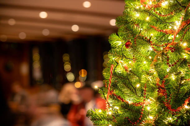istock Small Christmas tree on a classic boat with luxury interior 1198417606