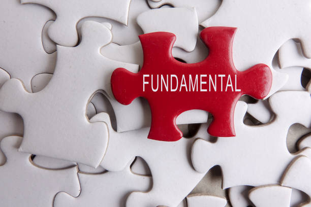 istock Red puzzle on a white puzzle background with text FUNDAMENTAL. FOREIGN EXCHANGE CONCEPT 1198418202