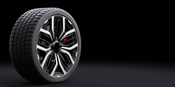 istock Wheel with modern alu rim on black background 1198419590
