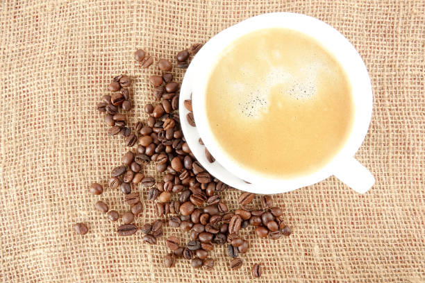 istock Coffee beans on a rug background 1198419803