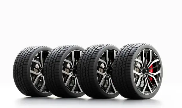 Set of wheels with modern alu rims on white background - banner composition. 3D illustration