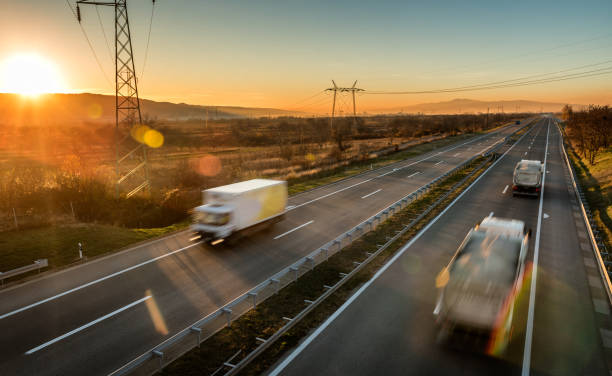 istock Fast blurred traffic in high speed motion driving on a highway 1198420595