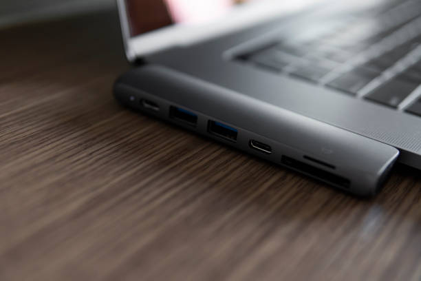 istock The USB adapter under the Type-C connector for laptop. Multiport station for laptop with multiple different ports. USB to USB Type-C Hub Converter. 1198421623