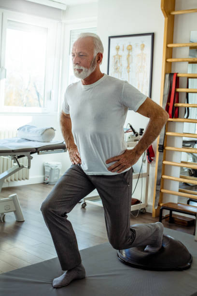 Make exercise part of your daily routine. Make exercise part of your daily routine. Senior man working exercise. stretched leg stock pictures, royalty-free photos & images