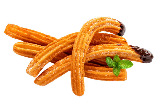 istock Churros isolated.  Fried dough pastry with sugar and chocolate sauce dip  on a white background. Churro sticks, traditional Spanish snack 1198422329