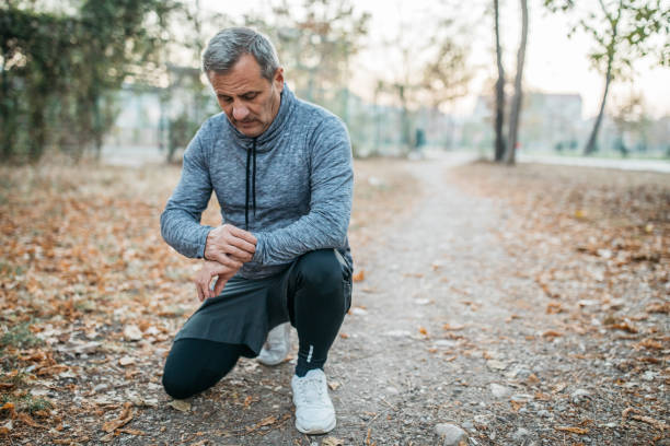 istock Senior man jogging in a public park 1198423394