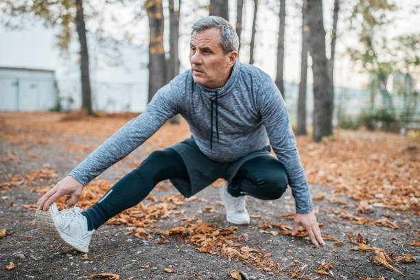 istock Senior man jogging in a public park 1198423418