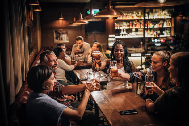 istock Friends drinking beer in the pub 1198424424
