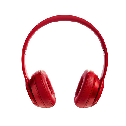 Red headphone on white background. Headphones isolated on a white background, product photography
