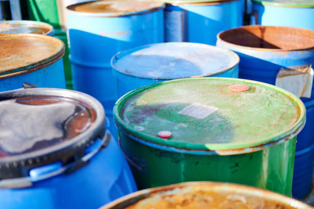 istock Recycling industry - Rusty metal barrels stacked in rows, toxic waste 1198424489
