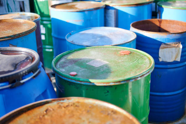 istock Recycling industry - Rusty metal barrels stacked in rows, toxic waste 1198424617