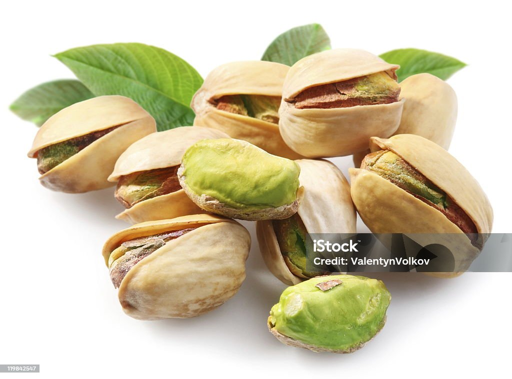 Pistachios with leaves.  Appetizer Stock Photo