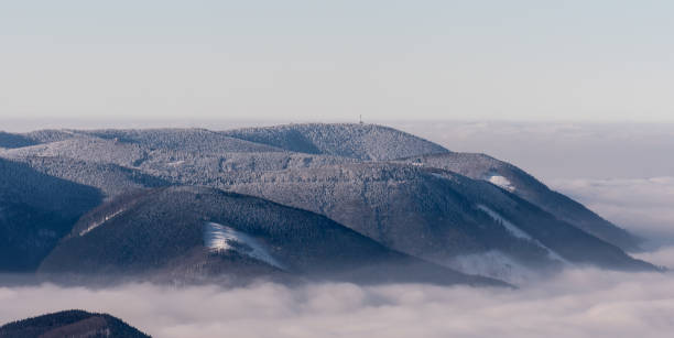 winter frozen Moravskoslezske Beskydy mountains with Radhost hill in Czech republic winter frozen Moravskoslezske Beskydy mountains with Radhost hill from Lysa hora hill in Czech republic moravian silesian beskids photos stock pictures, royalty-free photos & images