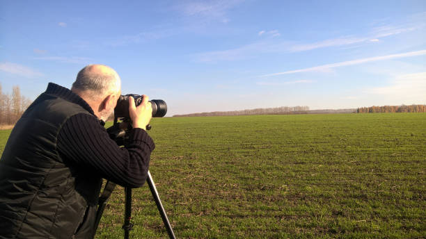 istock A male photographer in autumn. 1198427552