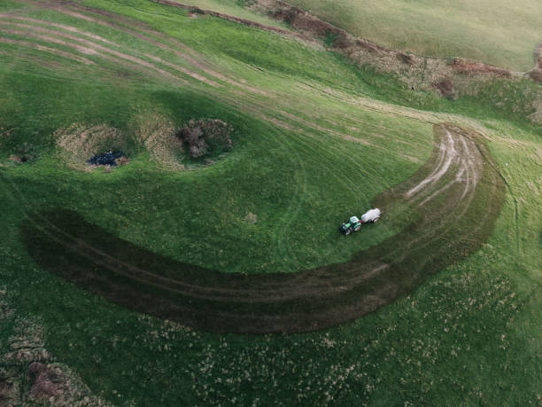 istock Tractor spraying manure in a field 1198428206