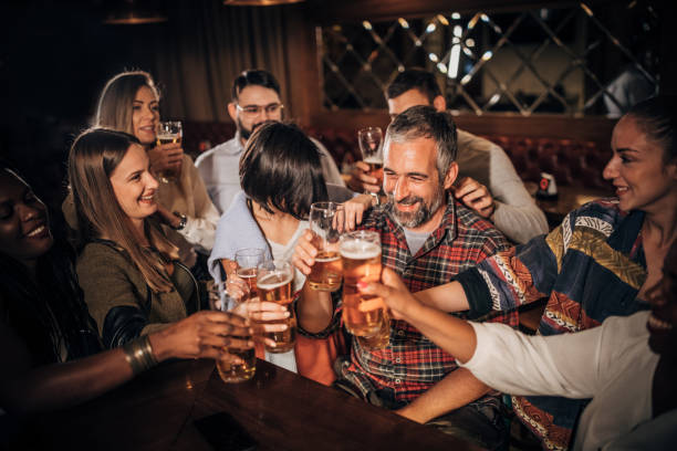 istock Friends drinking beer in the pub 1198428453