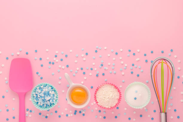 istock baking ingredients, egg, flour, sugar, sweet decoration and kitchen tools on pink background 1198430009