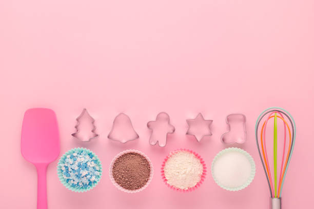 istock ingredients and cookie cutter on pink background, flat lay 1198431015