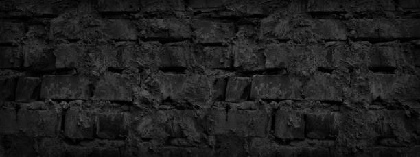 istock Black grunge background. Old dark gray brick wall. Close-up. Black stone background. 1198431223