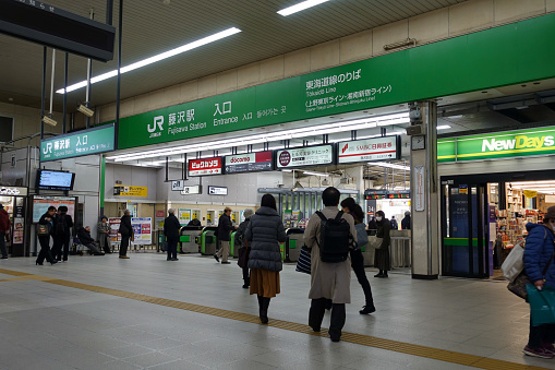 Fujisawa, Japan - January 09 2020: Fujisawa is one of the stations between Yokohama and Kamakura.  In the picture the sign that indicate the entrance of the Station to passengers. The picture has been took in front of the main entrance.