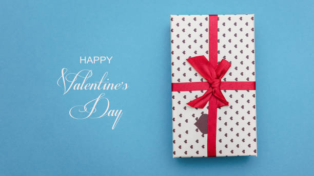 istock Concept for valentines day. Gift on a blue background. Inscription. 1198435705