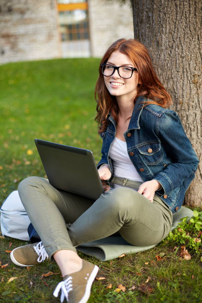 istock happy student girl writing to notebook at campus 1198435825