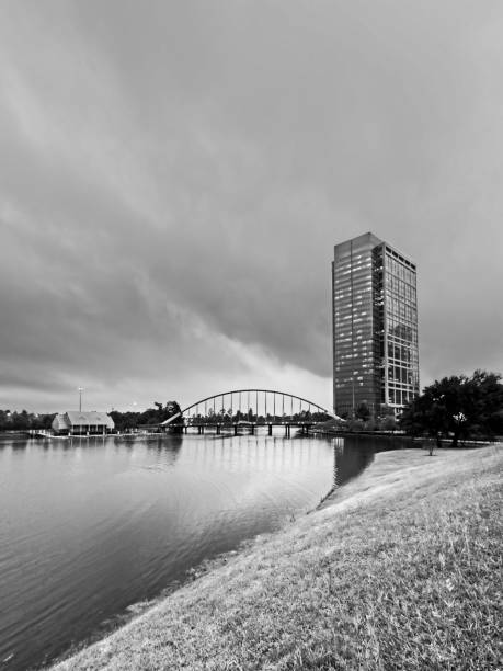 istock Tall Building and Bridge by Water 2 B&W 1198435951