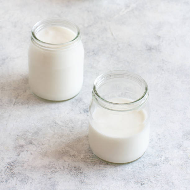 istock Fermented drink kefir in small bottles and kefir grains 1198438597