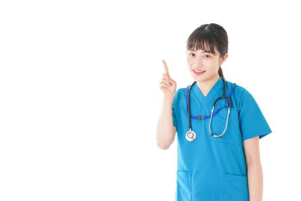 istock Young nurse with smile pointing something 1198442041