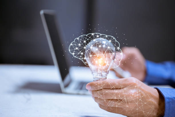 istock Business hand holding light bulb,with brain icon,creativity and innovative are keys to success,new ideas and innovation concept. 1198442777