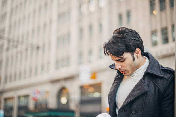 istock Handsome man drinking coffee in the city 1198443472